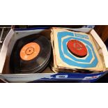 A box of vinyl 45 singles and a box of 78s