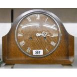 A mid 20th Century oak cased mantle clock with Smiths Enfield eight day gong striking movement