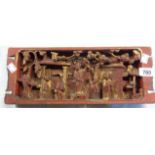 An antique Chinese carved wooden panel with red lacquer and gilt finish