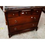 A 79cm 20th Century Stag polished wood chest with three short drawers over two long drawers, set