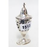 A Georgian style silver pedestal pepperette of pierced oval design by William Comyns & Sons - London