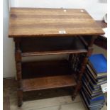 A 59cm late 19th Century oak lectern with two shelves and flanking decorative stick and ball lattice