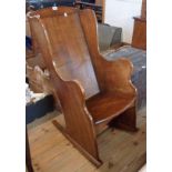 A 20th Century solid oak handmade lambing style rocking chair in the antique style