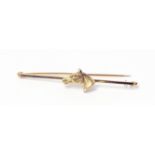 A marked 14ct. horse head pattern bar brooch