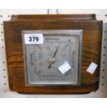 A mid 20th Century Art Deco style polished oak cased Shortland Smiths aneroid wall barometer