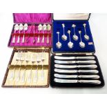A cased set of six silver handled butter knives - sold with three cased sets of silver plated