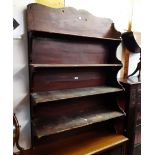 A 97cm antique wood grained pine wall hanging four shelf open bookcase with bracket to one end and