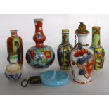 A pair and two similar Chinese miniature clobbered vases and a similar scent bottle - sold with a