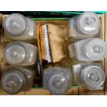 A box containing seven vintage glass storage jars