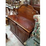 A 1.38m Victorian mahogany chiffonier with acanthus scroll shaped raised back over a base with two