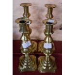 Two pairs of Victorian brass ejector candlesticks