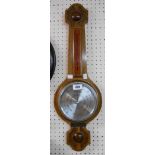A 20th Century Comitti of London polished oak cased banjo barometer/thermometer with aneroid works