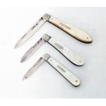 Three antique silver folding fruit knives all with mother-of-pearl clad handles - various makers