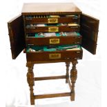 An oak drawer fitted Walker & Hall table canteen on stand, fully fitted with mother-of-pearl handled