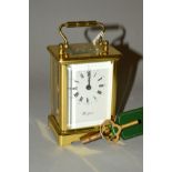 A MODERN BRASS CASED WOODFORD OF ENGLAND CARRIAGE CLOCK, glazed sides, back and top, white painted