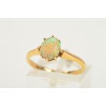 AN 18CT GOLD OPAL RING, designed as an oval opal cabochon within an eight claw setting, with 18ct