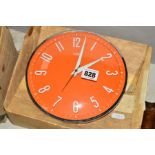 A METAMEC TANGERINE ELECTRIC WALL CLOCK, No 868, tangerine background with raised white numbers,