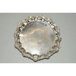 A GEORGE VI SILVER WAITER, shell and pie crust rim, engraved floral border and presentation