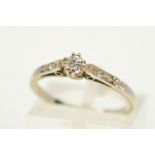 A DIAMOND RING, designed as a central brilliant cut diamond in an eight claw setting, with a