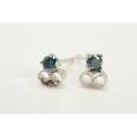 A PAIR OF 18CT WHITE GOLD TREATED BLUE DIAMOND STUD EARRINGS, each designed as a brilliant cut