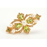 A 9CT GOLD PERIDOT, PEARL AND DIAMOND BROOCH, designed as a central cultured pearl surrounded by