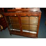 A MODERN MAHOGANY TWO DOOR CHINA CABINET (key)