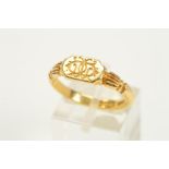 A MID VICTORIAN 18CT GOLD RING, the central panel with engraved scrolling monogram, with engraved