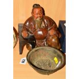 AN ORIENTAL PAINTED WOODEN FIGURE OF AN ELDER, seated by a table, height 18cm together with an