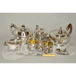 A BOX OF SILVER PLATE, including a cream and sugar on stand, two tea pots, serving utensils, etc