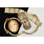 FOUR ITEMS OF JEWELLERY, to include an oval cameo brooch, a bangle with pierced floral and foliate