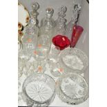 A COLLECTION OF TEN CUT GLASS AND ETCHED GLASS DECANTERS, together with cut glass and etched glass