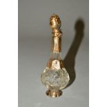 A 19TH CENTURY CUT GLASS, GOLD AND GILT METAL MOUNTED SCENT BOTTLE, base and lower neck collars bear