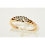 AN EARLY 20TH CENTURY 18CT GOLD THREE STONE DIAMOND RING, designed as a line of three graduated