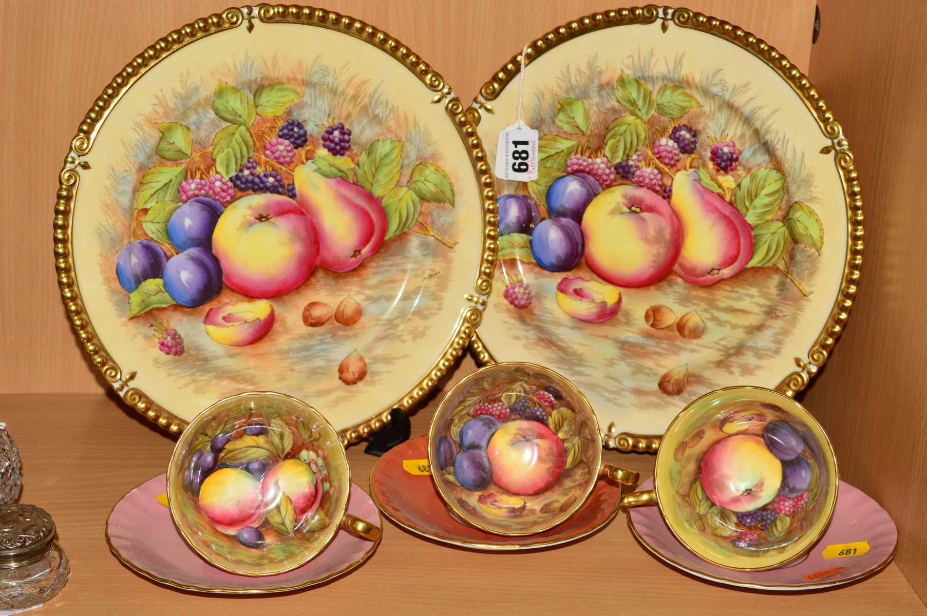 AYNSLEY ORCHARD GOLD, to include a pair of plates decorated by Nancy Brunt, diameter 26cm,