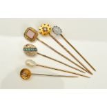 SIX STICKPINS, most late 19th to early 20th century, one designed as a square piece of carnelian