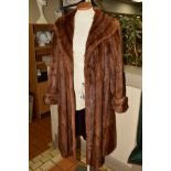 A FUR COAT, believed to be Musquash, with alpel collar, wide sleeves, two hook fastenings and