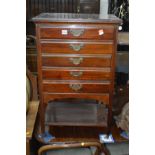 AN EDWARDIAN MAHOGANY FIVE DRAWER MUSIC CABINET, width 52cm x depth 37cm x height 83cm (missing