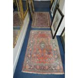 AN AFSHAR STYLE RED GROUND RUG, 179cm x 100cm together with a floral red ground rug (2)