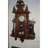 A VICTORIAN WALNUT VIENNA WALL CLOCK, eagle pediment, Roman numeral flanked by later added shelfs