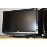 A BUSH 26'' LCD TV (one remote)