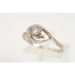 A 9CT WHITE GOLD DIAMOND RING, designed as a brilliant cut diamond in an illusion setting to the