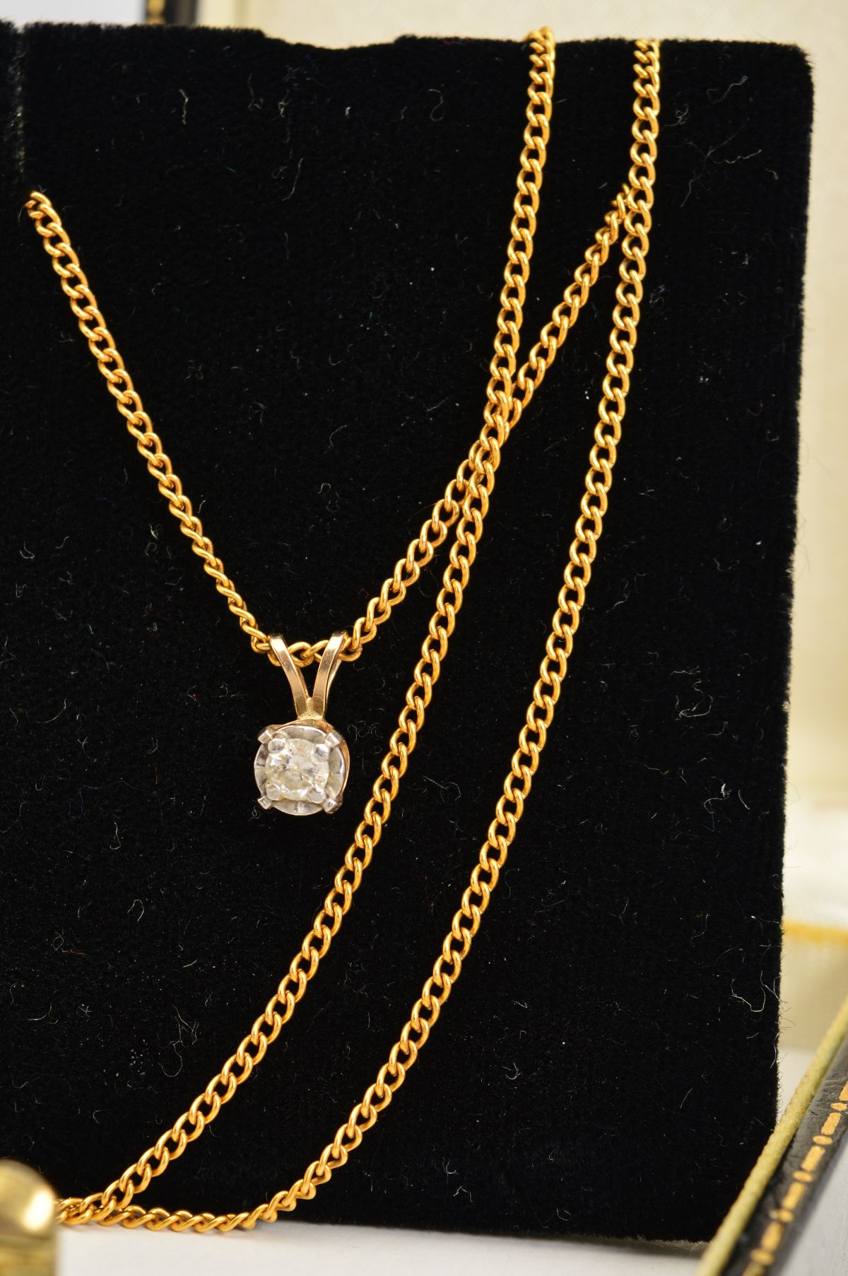 A DIAMOND PENDANT AND CHAIN, the brilliant cut diamond within a four claw illusion setting suspended