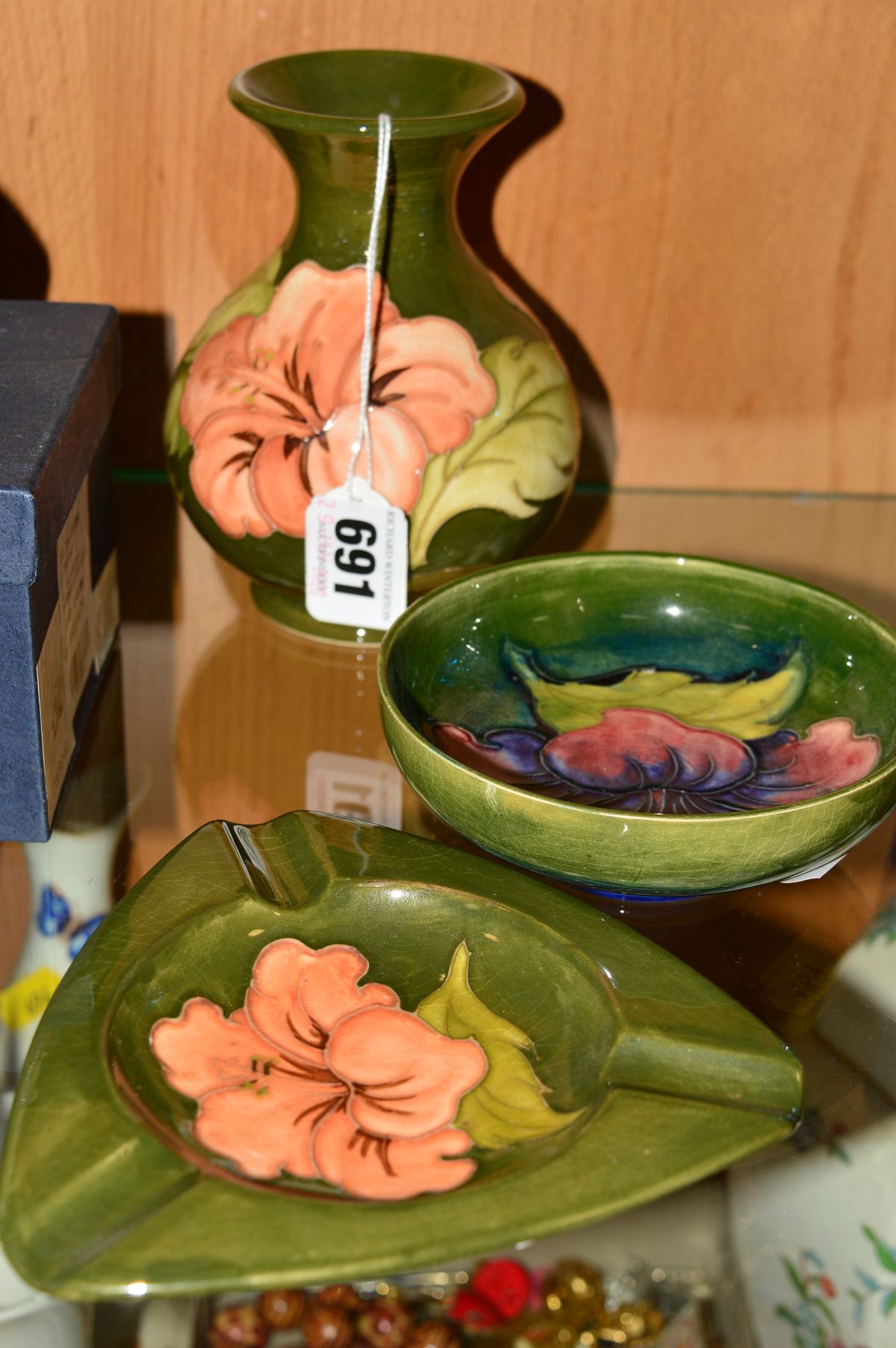 THREE PIECES MOORCROFT POTTERY, 'Hibiscus' pattern comprising small vase, Queen Mary paper label