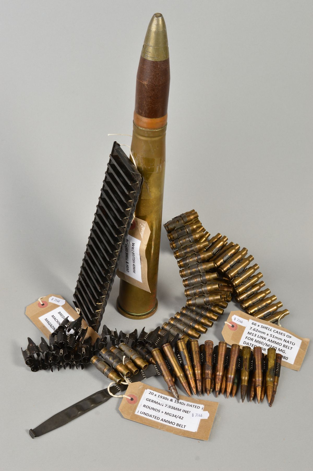 A SELECTION OF INERT AMMUNITION BELTS AS FOLLOWS (a) shell cases and belt for 7.62 x 51mm NATO