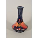 A MOORCROFT POTTERY BUD VASE, 'Pomegranate' pattern, impressed backstamp and painted signature to