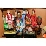 A GROUP OF RUSSIAN RELATED ITEMS, comprising six painted faced dolls with traditional costume,