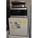 A FRIDGEMASTER TABLE TOP FREEZER together with a Tesco brand microwave and a Lakeland foldout