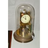 A BRASS GUSTAV BECKER ANNIVERSARY CLOCK, standing on a brown metal base, under glass dome, enamelled