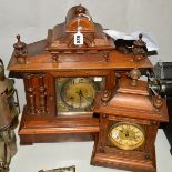 A MAHOGANY AND OAK MANTLE CLOCK, having carved pillars and finials (damage to veneer), silvered dial