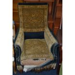 A DISTRESSED LATE VICTORIAN UPHOLSTERED CLUB CHAIR
